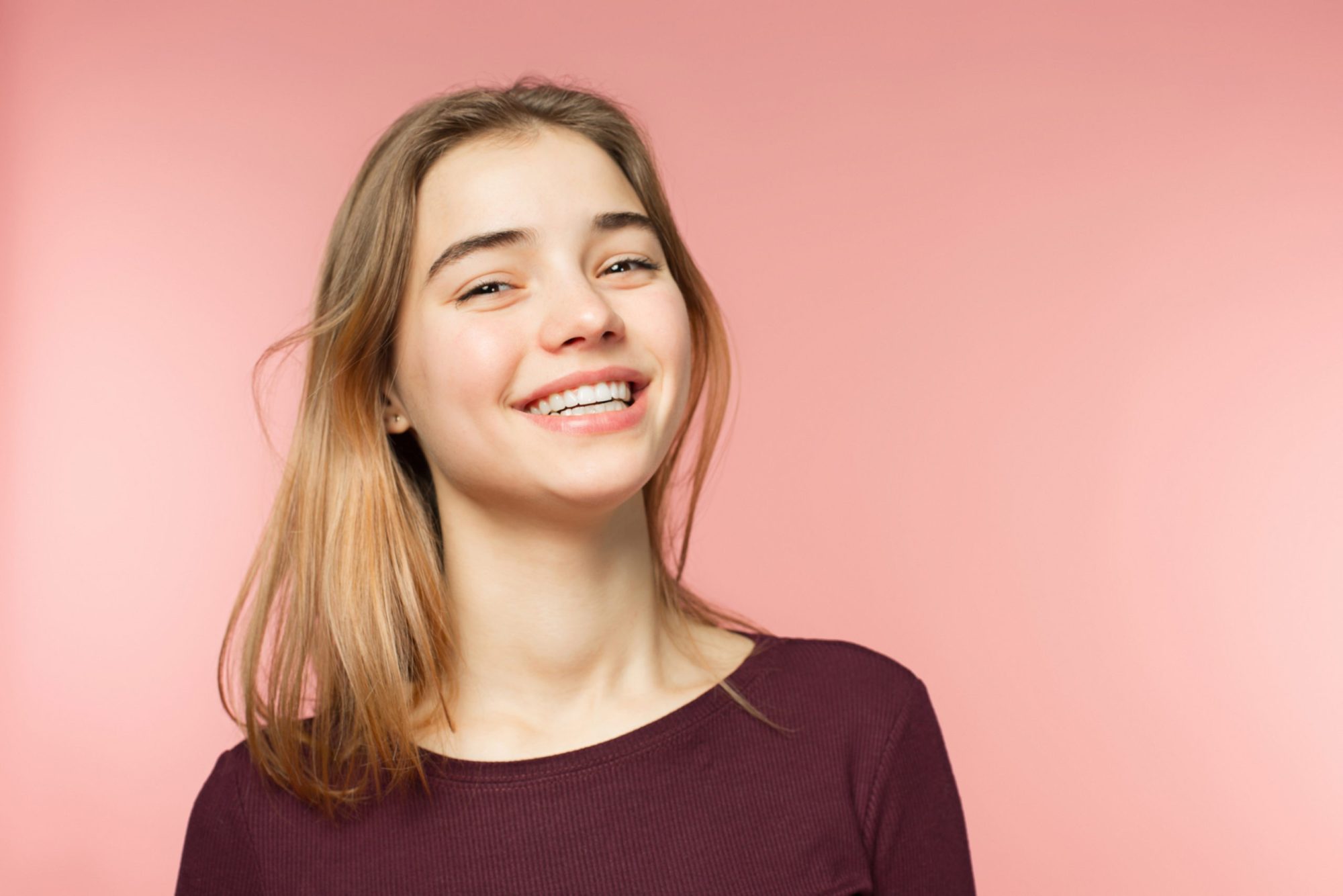 Smiling patient with straight teeth after braces or Invisalign treatment at Weissman Orthodontics in Birmingham, AL